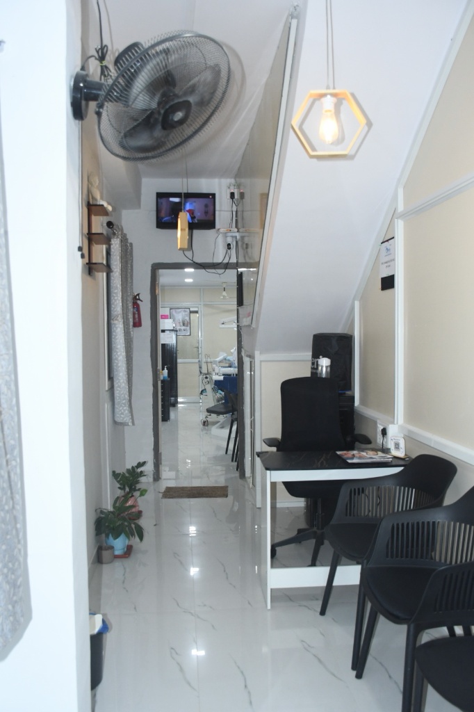 Real patient waiting lounge and consultation corridor at ORIS Speciality Dentistry